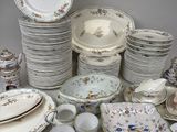 many different types of china plates and bowls on the table