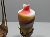 two vases that are sitting on a table