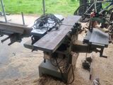 a machine that is sitting on a table in the dirt