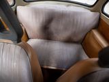a seat in the back of a car that is dirty
