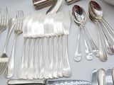 a table with silverware and silverware on it