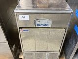 a machine that is sitting on a pallet next to a door