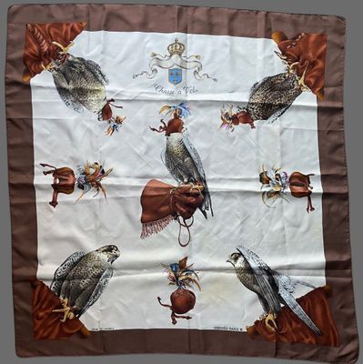 an image of a brown and white scarf with birds on it