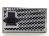 a close up of a computer power supply on a white surface