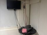 a picture of a bathroom with a sink and a television