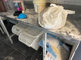 an image of a dirty kitchen counter with a trash bag on top of it
