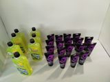 a lot of bottles of purple and black liquid on the counter