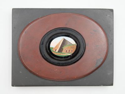 a picture of a picture of a building through a hole in the wall