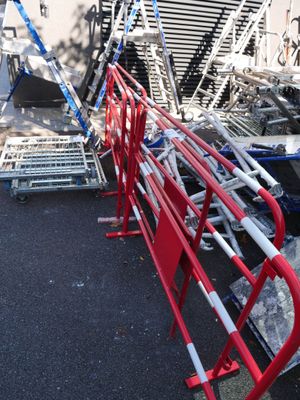 a lot of red and white chairs in a parking lot