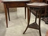 a small table with a glass top in the middle of a room