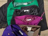 five pairs of pants on a hanger on the floor