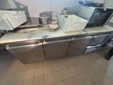two microwaves on top of a counter in a kitchen