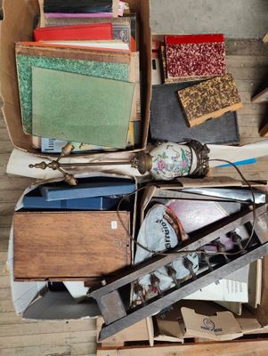 a box full of assorted items on a wooden floor