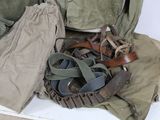 a pile of military items sitting on a white surface