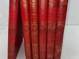 a set of five red books with gold foil on them