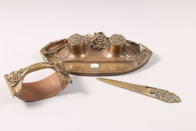 a gold plate with a knife and a spoon on it