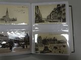 an open book with pictures of buildings and a clock tower