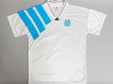 a white shirt with blue and white stripes on the chest