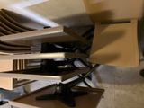 several chairs stacked on top of each other in a room