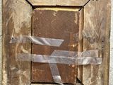 a picture of a piece of wood with a ribbon on it