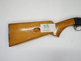 a shotgun with a price tag on it sitting on a table