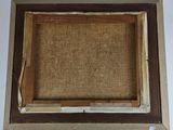 an old picture of a picture frame with a piece of wood in it