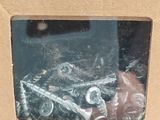 a box of screws in the middle of a cardboard box