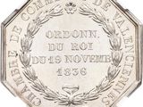 an image of a silver coin with a wreath on top of it