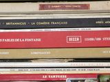 many books stacked on top of each other on a shelf