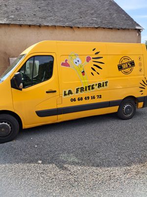 a yellow van that is parked in front of a building