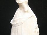 a statue of a woman in a white dress