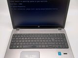 a laptop with a blue screen sitting on a table