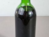 a bottle of wine that is sitting on a table