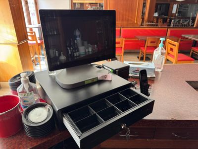 a computer monitor sitting on top of a desk