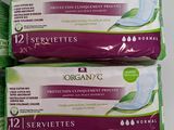 two packs of organy c sanitary wipes sitting on a table