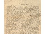 une lettre écrite en cursive sur une feuille de papier