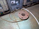 a large metal container with a couple of wires on top of it