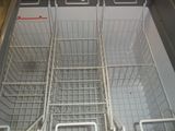 two baskets in the bottom of a dishwasher