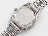 an image of a close up of a wrist watch on a white surface