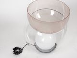 a light that is sitting inside of a glass bowl