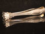 two spoons that are sitting on a table