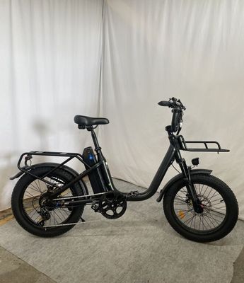 an image of an electric bike parked in front of a white curtain