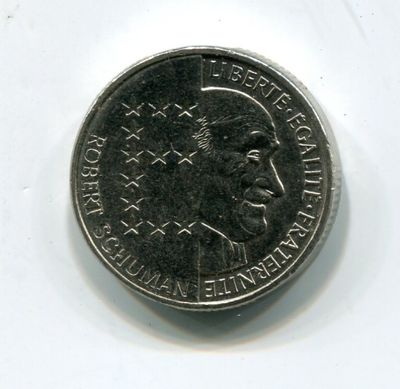 an image of a close up of a coin on a white surface
