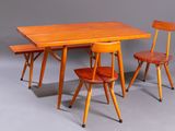 two wooden chairs and a table on a grey background