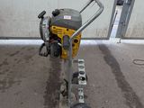a small machine that is sitting on the side of the road