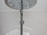 a shower head that is attached to the wall