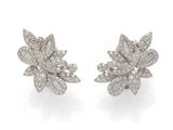 a pair of diamond and white gold earrings