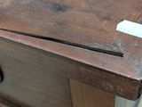 a piece of wood with a piece of paper on it