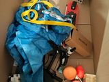 a box filled with assorted items and a pair of scissors