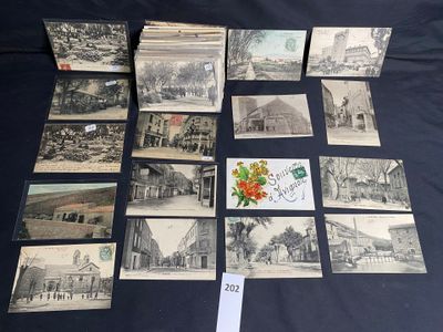 many old postcards on a table with a bunch of them